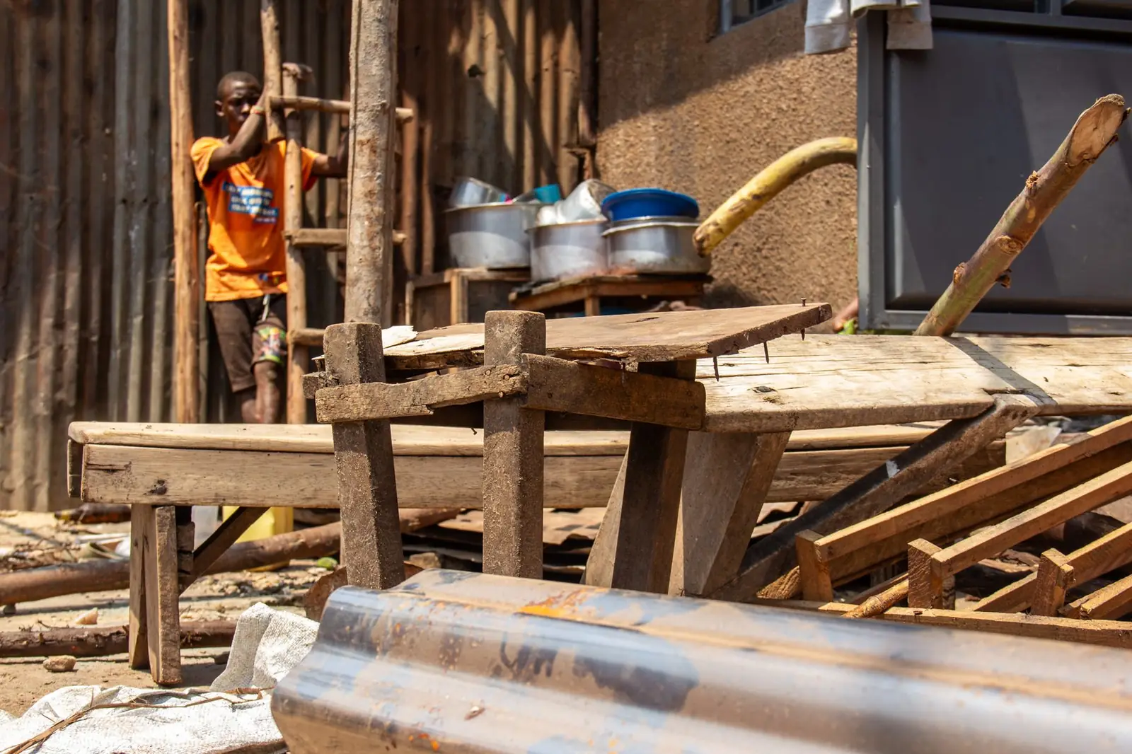 Young person in a community workshop yard