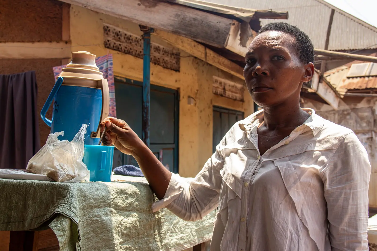 Community woman preparing refreshments outdoors